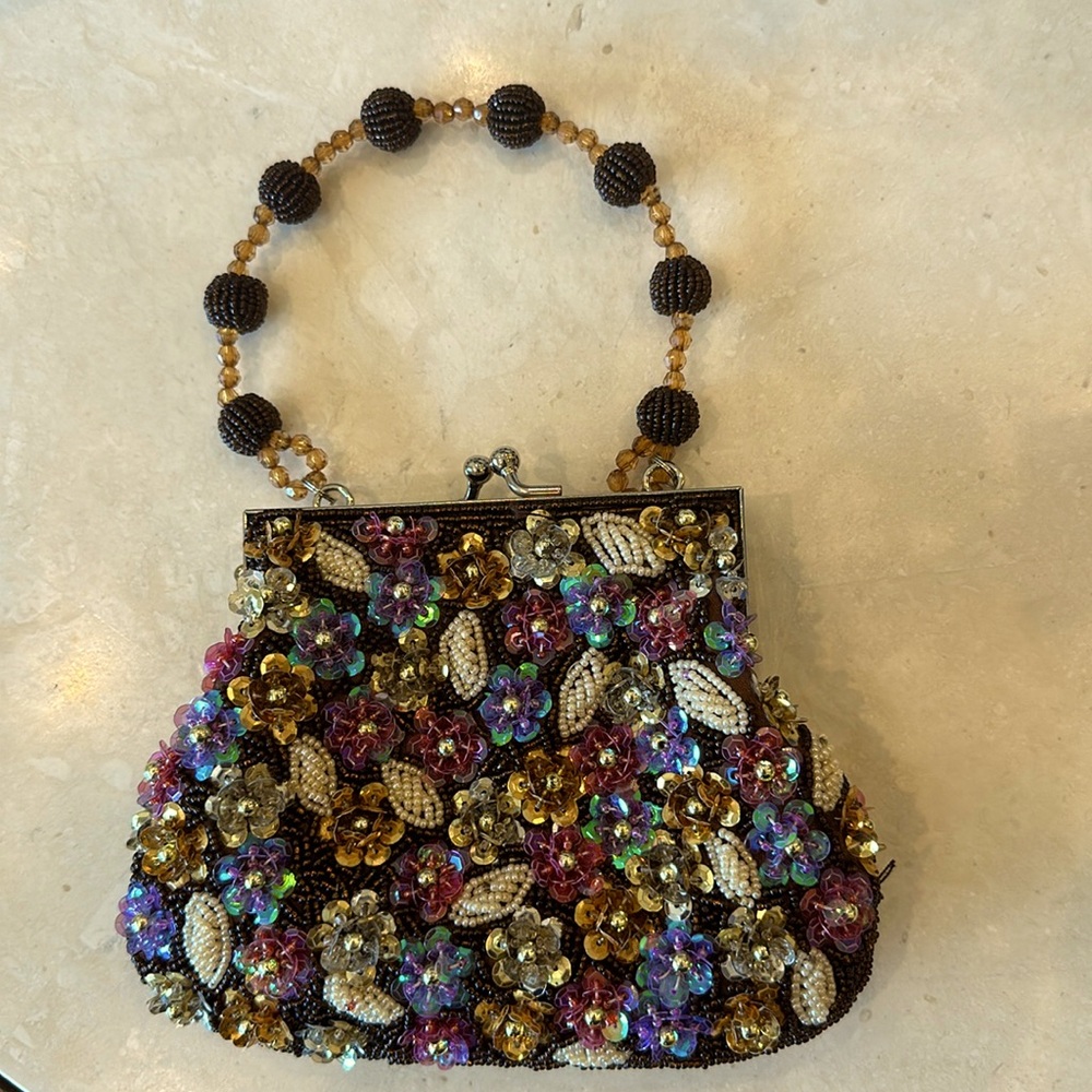 Far Nine vintage beaded bag with silver kiss closure. Excellent condition.